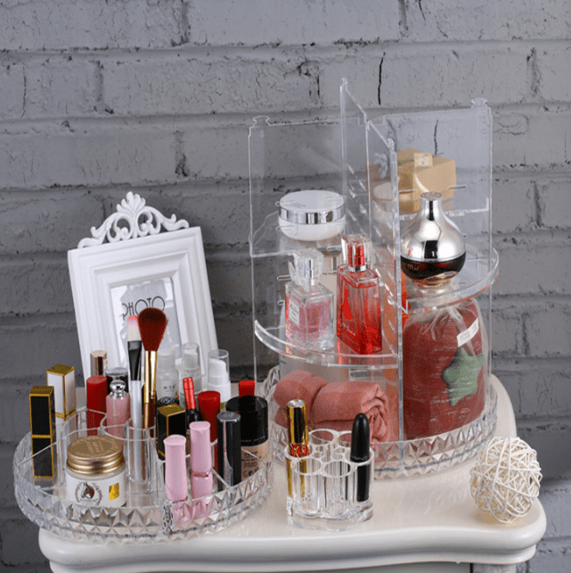 The clear organiser taken apart into a low tray with lipsticks and a taller shelf section, side by side