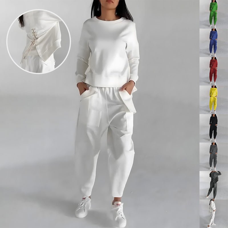 White round-neck sweatshirt and jogger trousers set, front view on model, lace-up detail at back hem shown in close-up