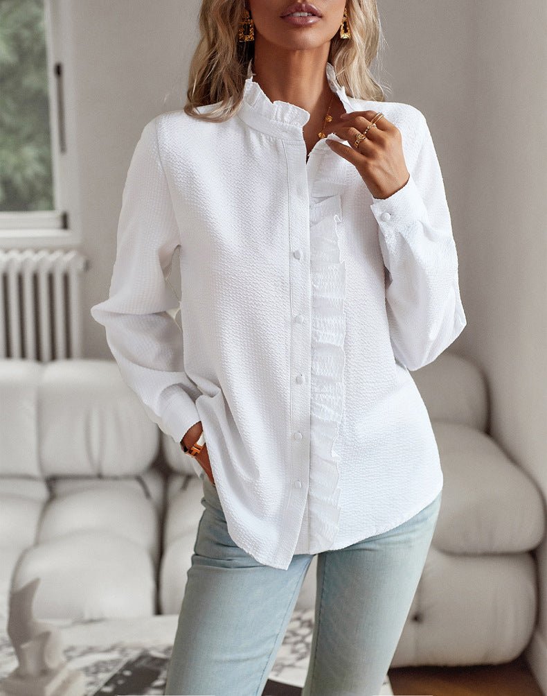 White ruffle blouse worn loose over light jeans