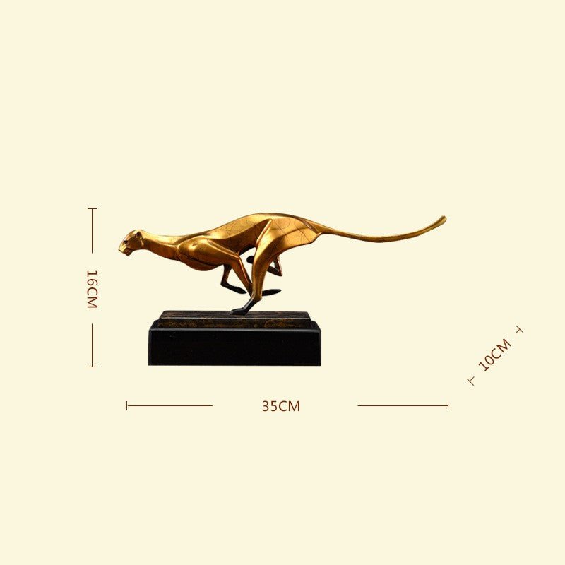 Gold-coloured leopard sculpture with measurements: 35 cm long, 16 cm high, 10 cm deep