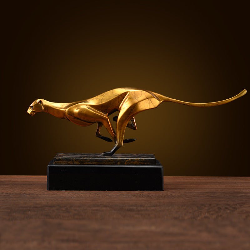 Closer side view of the gold-coloured leopard with its tail stretched out behind it