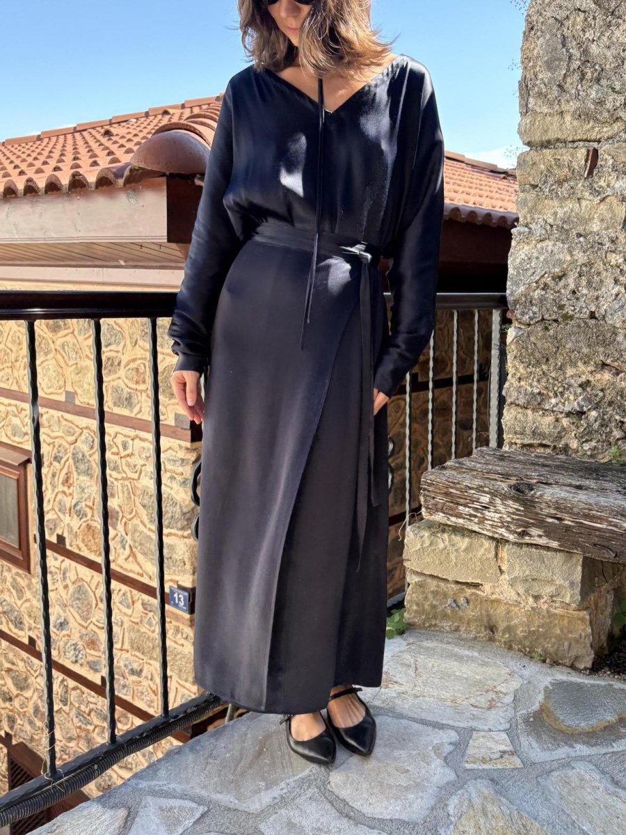 Front view of the navy dress with the tie belt knotted at the side