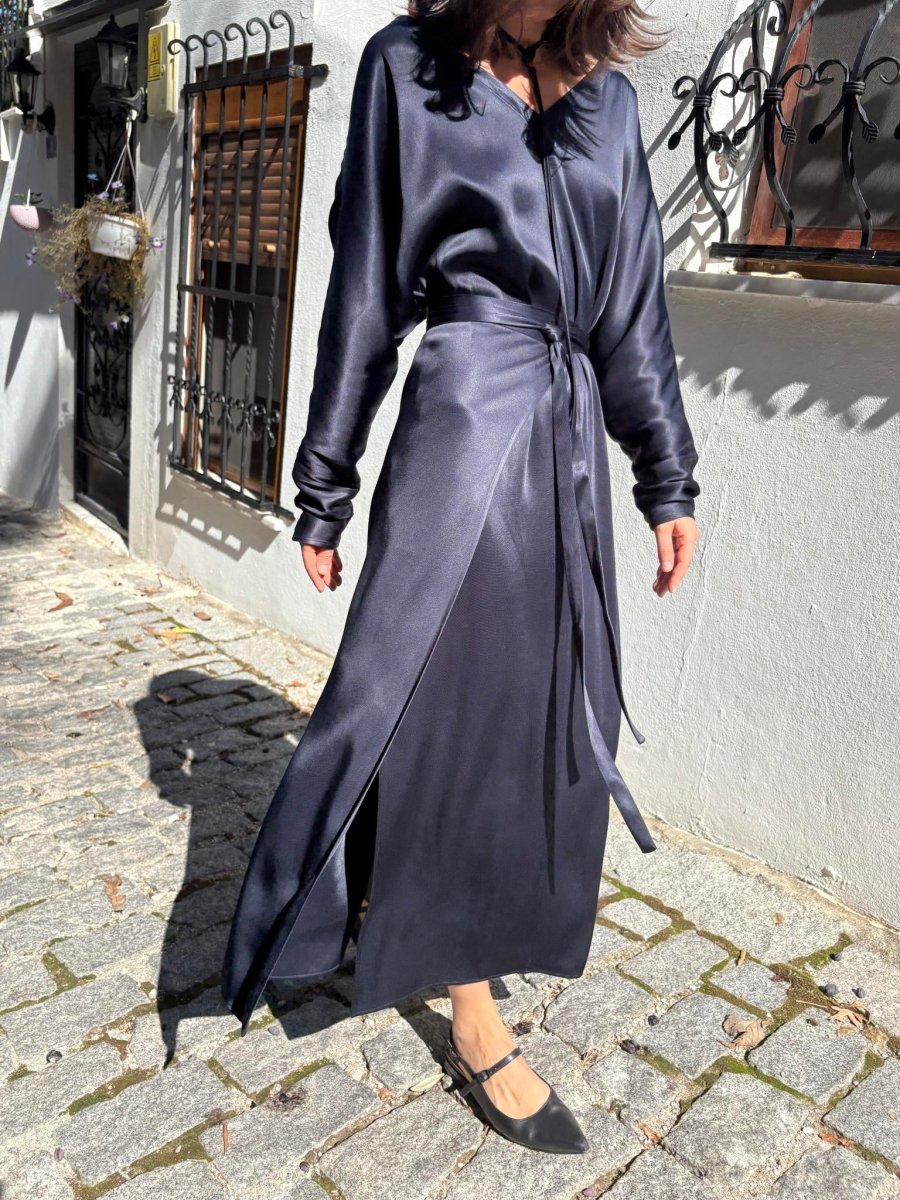 Navy wrap maxi dress with long belt ends hanging at the side