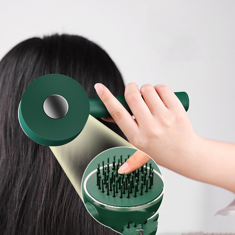 Person with long dark hair holding the green brush and pressing the button, with a close-up of the pins