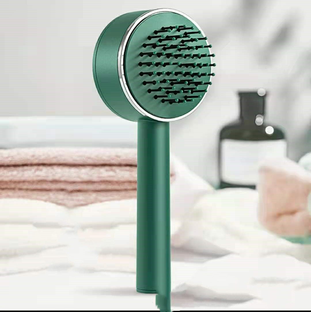 Green self-cleaning hairbrush standing upright in a bathroom setting