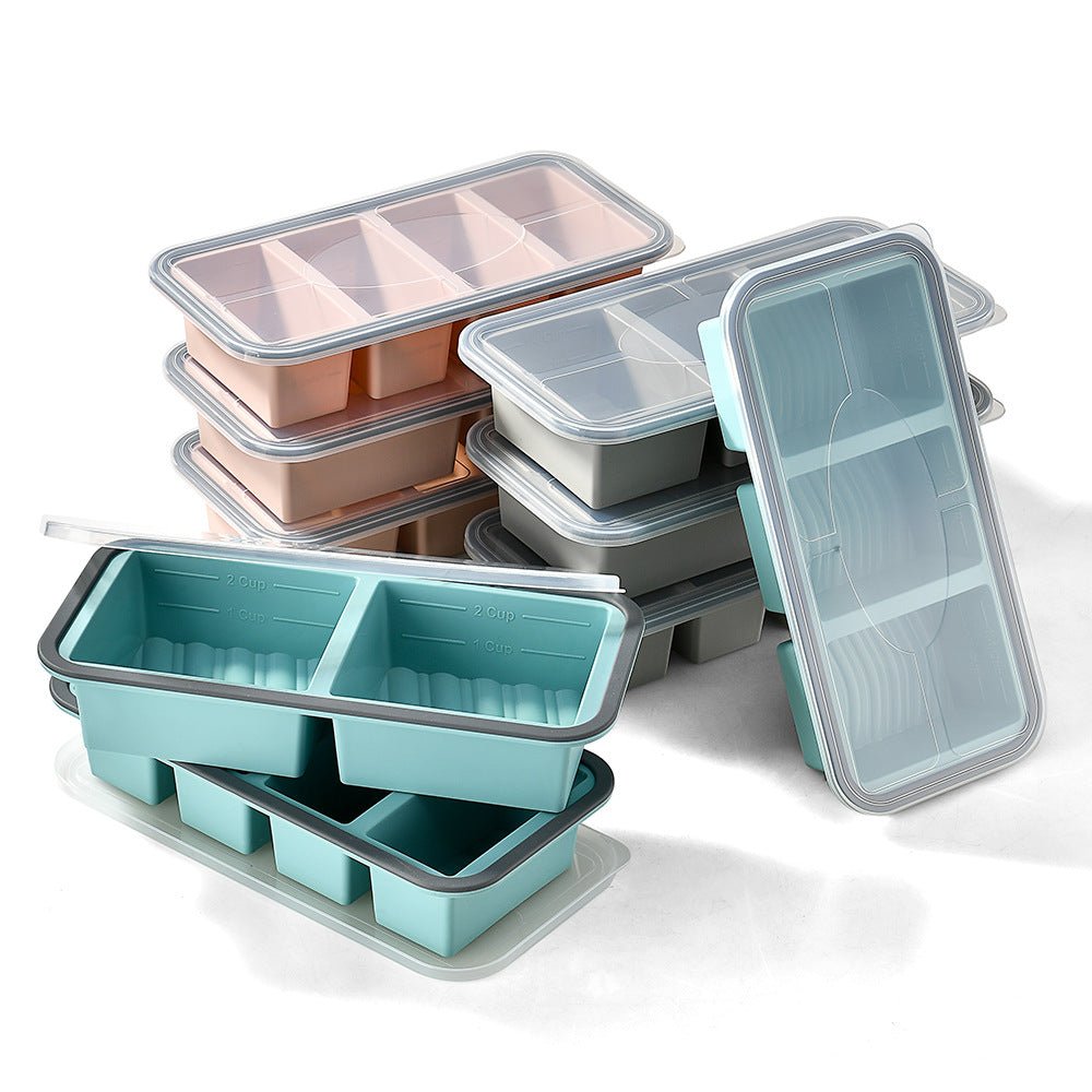 Stack of portion trays in grey, pink and teal with clear lids
