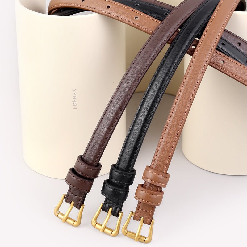 Skinny leather belt with golden buckle on model - statement accessory fashion belt