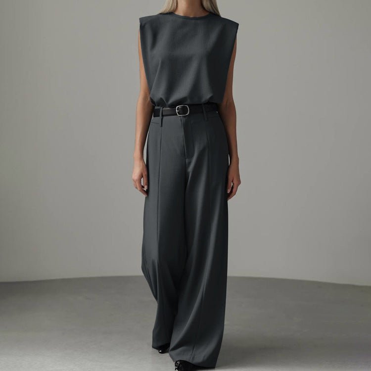 Grey co-ord set: sleeveless top tucked into wide-leg trousers, worn with a black belt