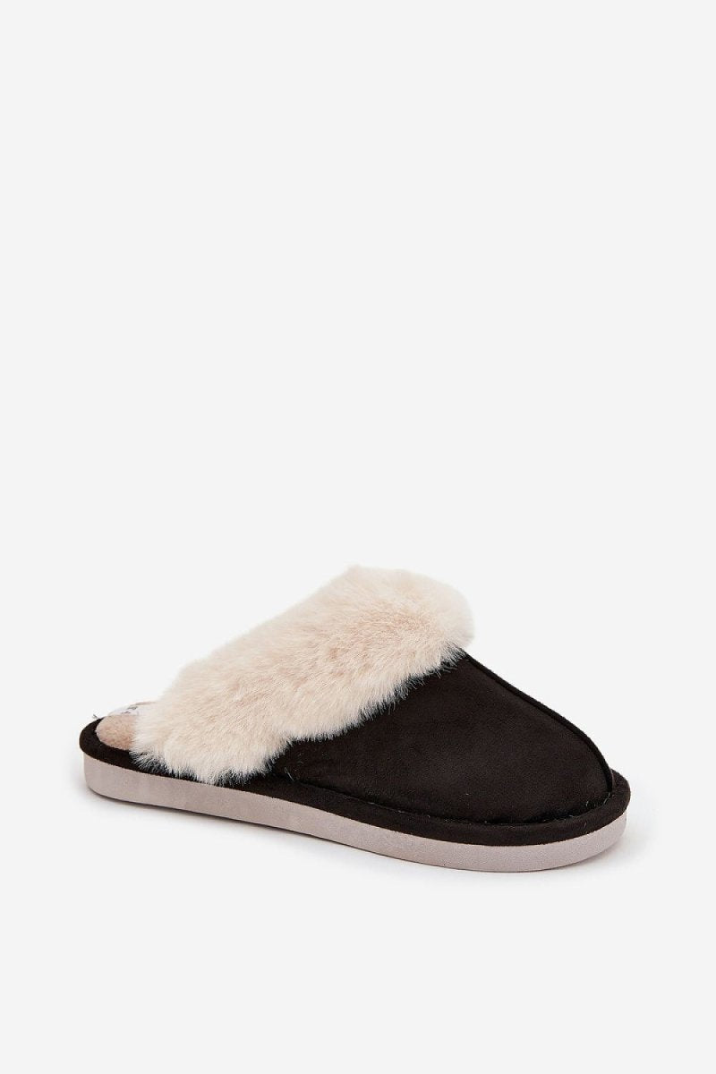 Step In Style slippers worn in a cozy home setting