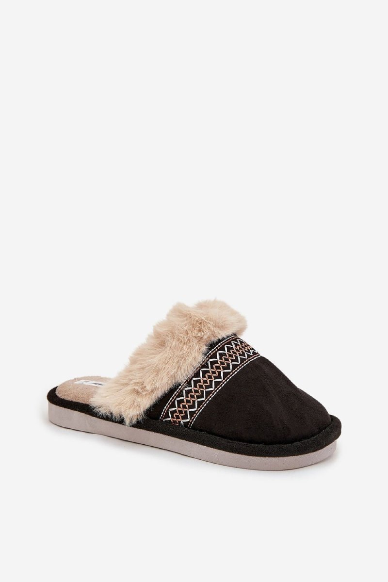 Slippers next to cozy home decor