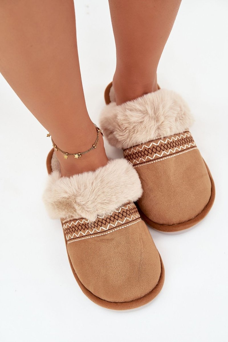 Green fur slippers in natural light