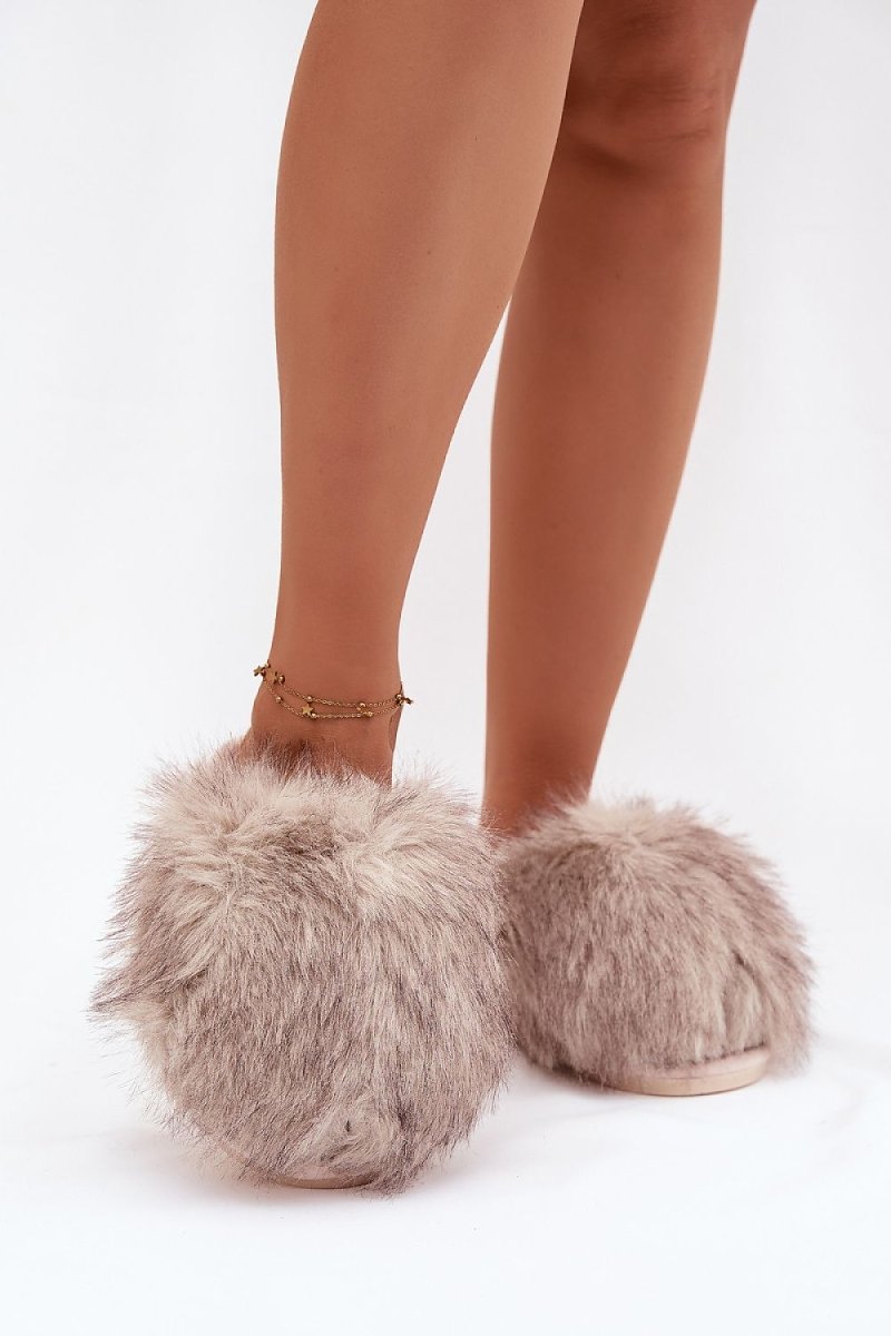 Beige fur slippers showcasing soft texture