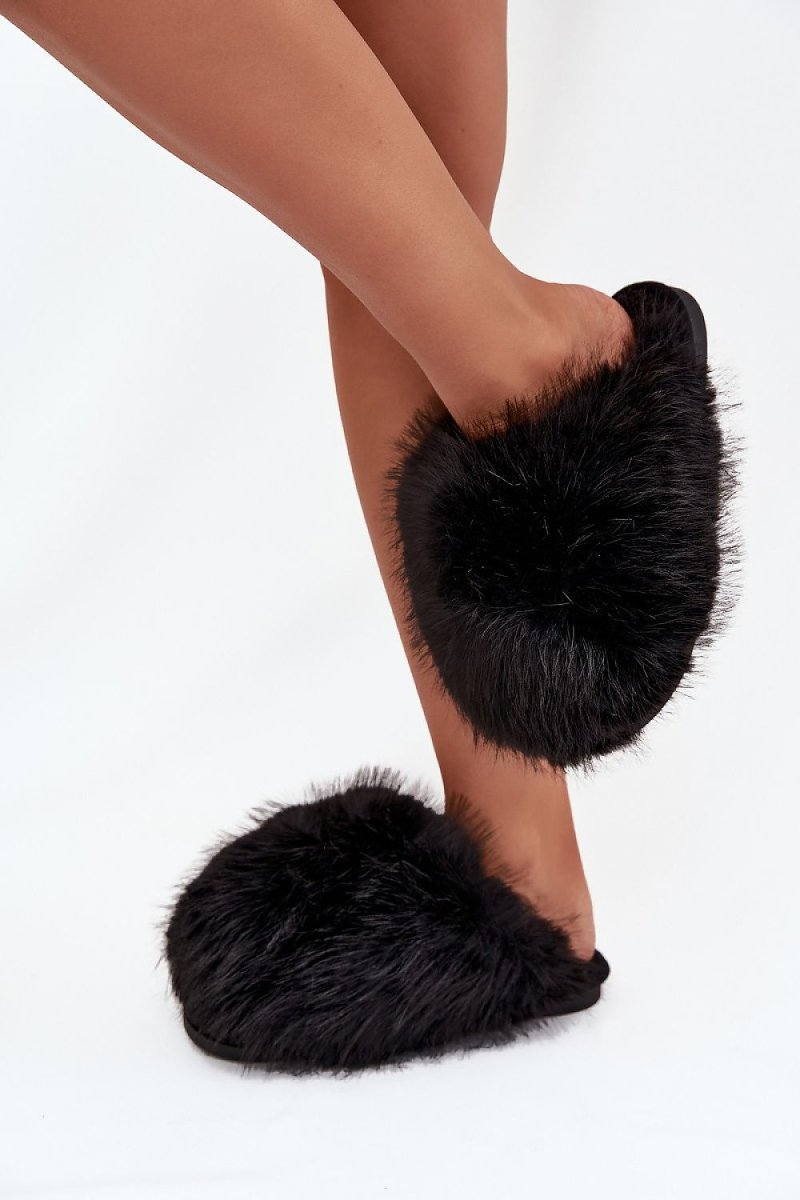 Lifestyle image of slippers in cozy home setting