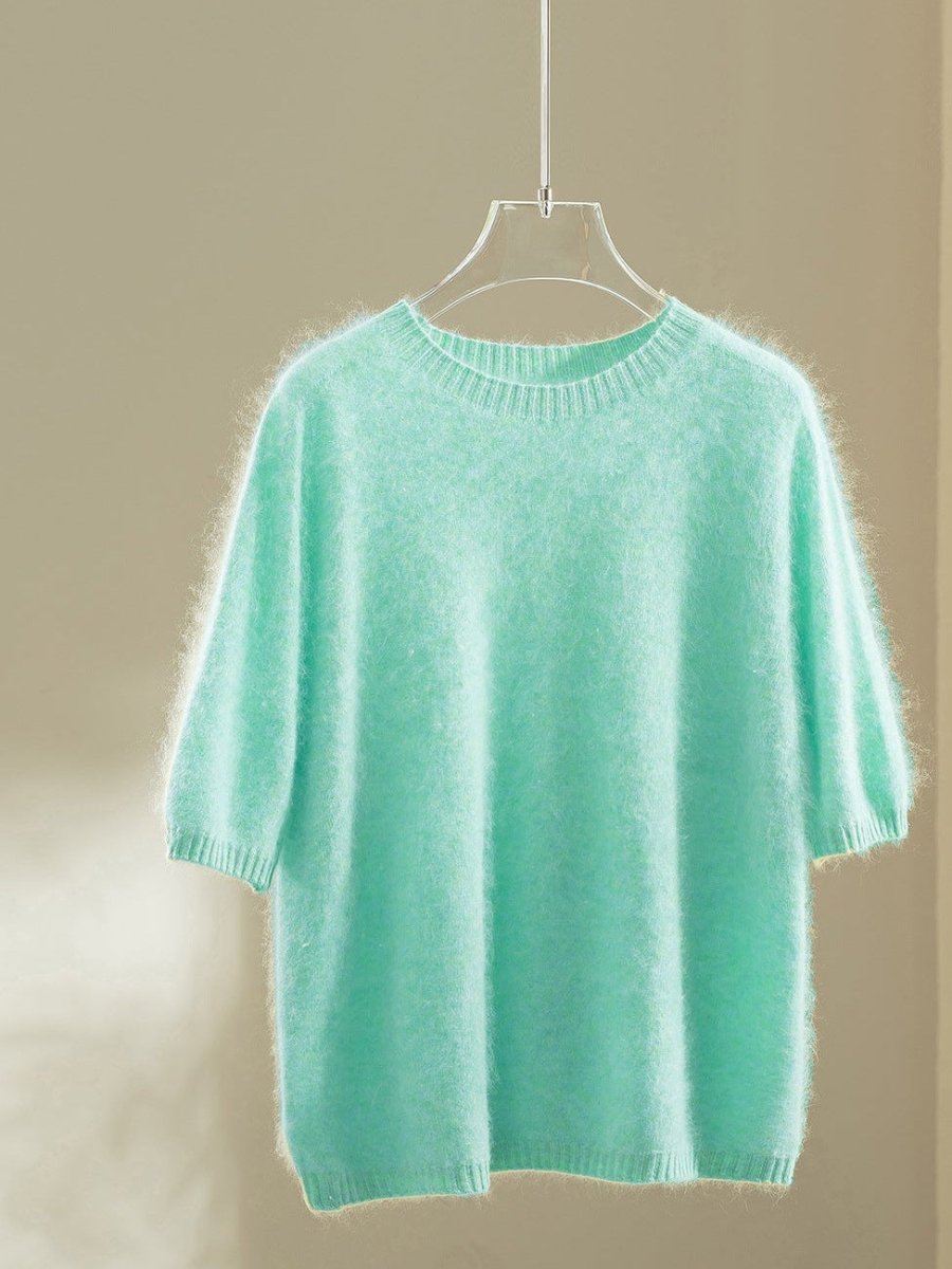 Mint wool blend jumper with elbow-length puff sleeves on a hanger