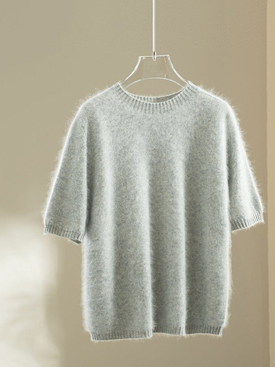 Light grey wool blend jumper with elbow-length puff sleeves on a hanger