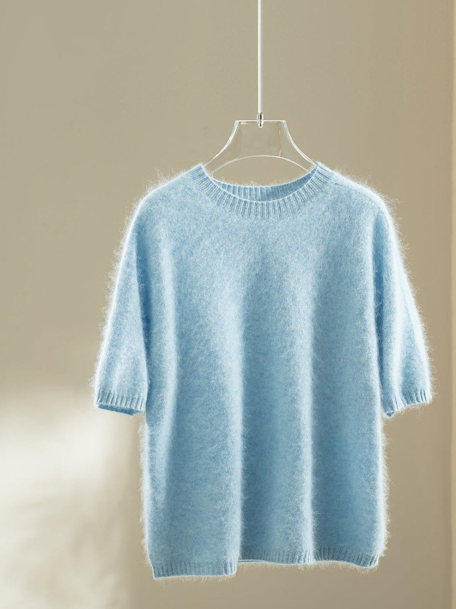 Sky blue wool blend jumper with elbow-length puff sleeves on a hanger