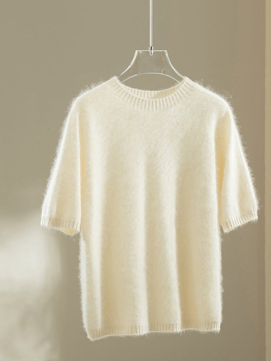 Ivory wool blend jumper with elbow-length puff sleeves on a hanger