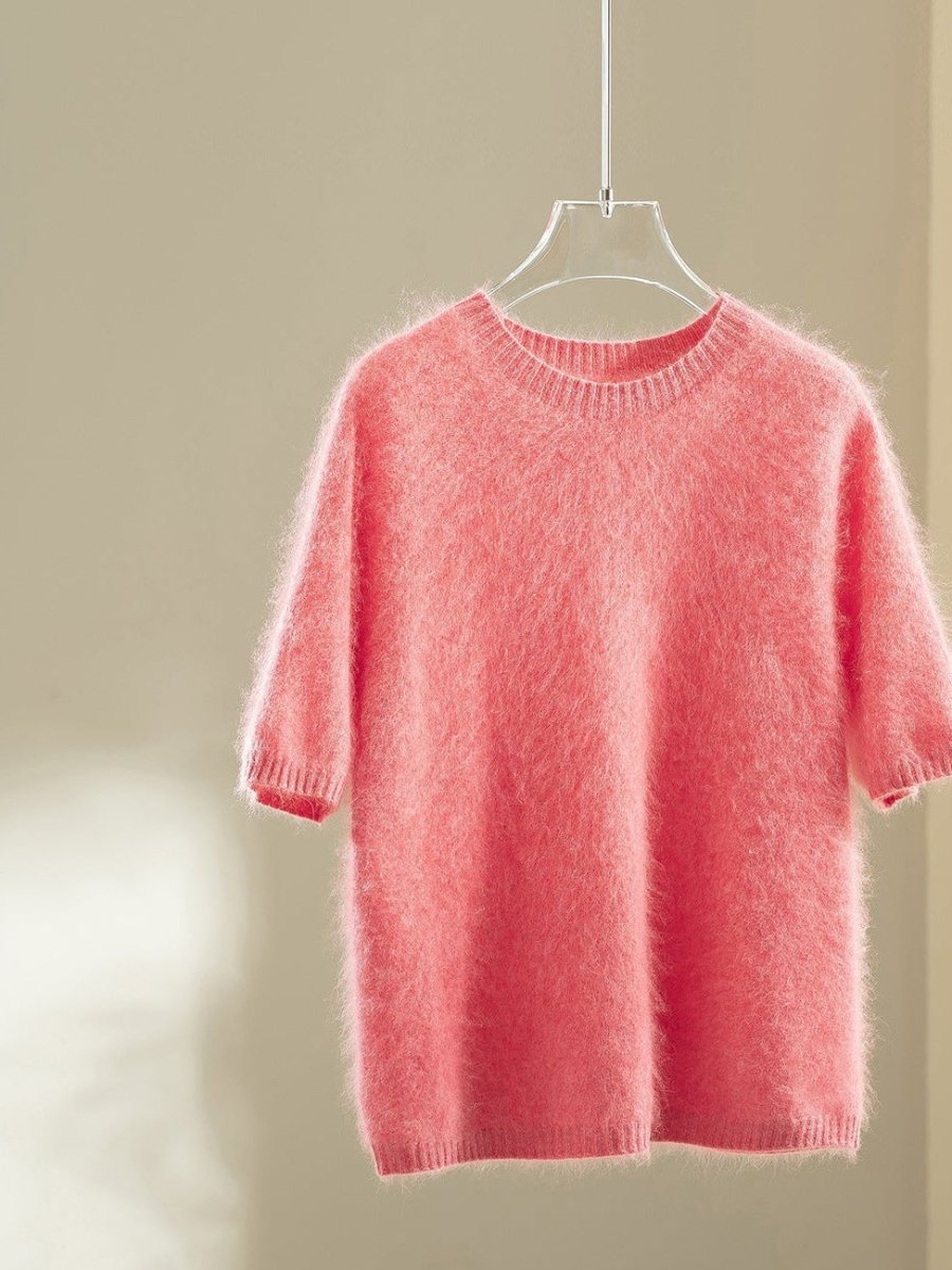 Coral wool blend jumper with elbow-length puff sleeves on a hanger