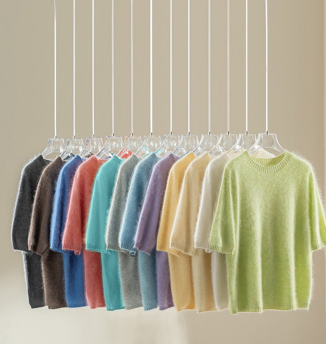 All 12 colours of the short-sleeve wool blend jumper hanging side by side
