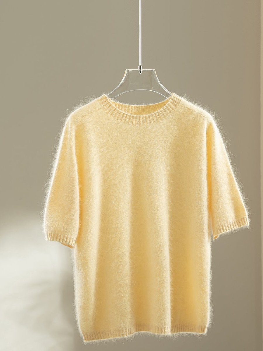 Butter yellow wool blend jumper with elbow-length puff sleeves on a hanger
