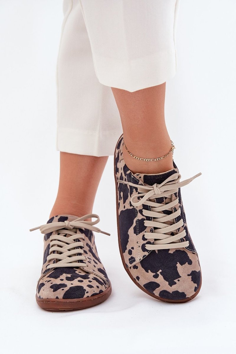 Brown suede barefoot sneakers from a side angle
