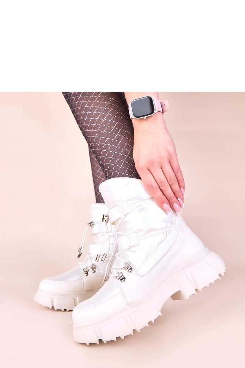 Side profile of pearl white winter boots