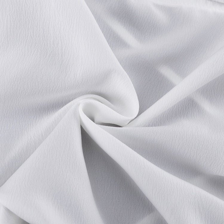 Close-up of the white fabric with a fine crinkle texture