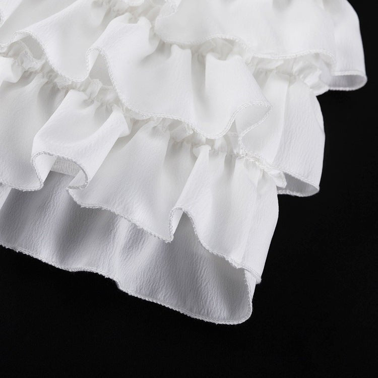 Layered ruffles at the hem of the skirt