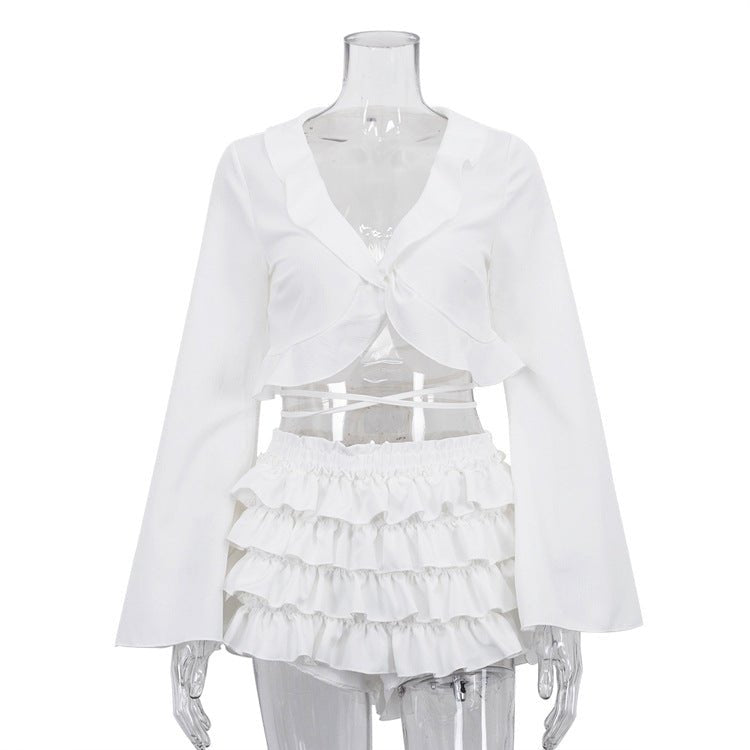 White set on a mannequin, front: tie-front top and tiered ruffle skirt
