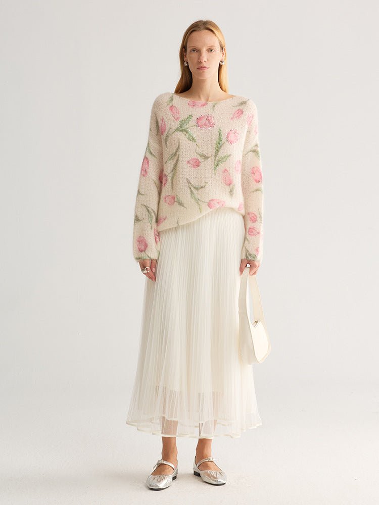 Tulip and floral print fuzzy knit jumper, wide neck, cream with pink flowers, full length on model with pleated skirt, studio