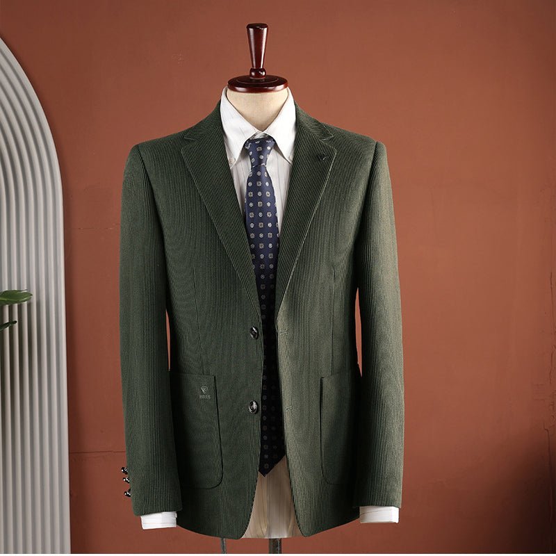 Green blazer worn open over a shirt and tie